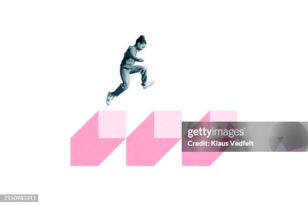 girl jumping over pink blocks - fare un passo foto e immagini stock