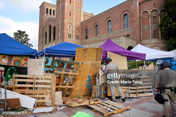 California Highway Patrol officers patrol at a pro-Palestinian encampment, the morning after it was attacked by counter-protestors at the University...