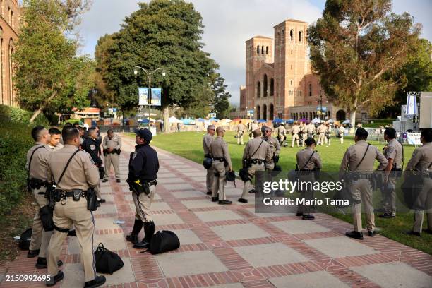 California Highway Patrol officers keep watch at a pro-Palestinian encampment, the morning after it was attacked by counter-protestors at the...