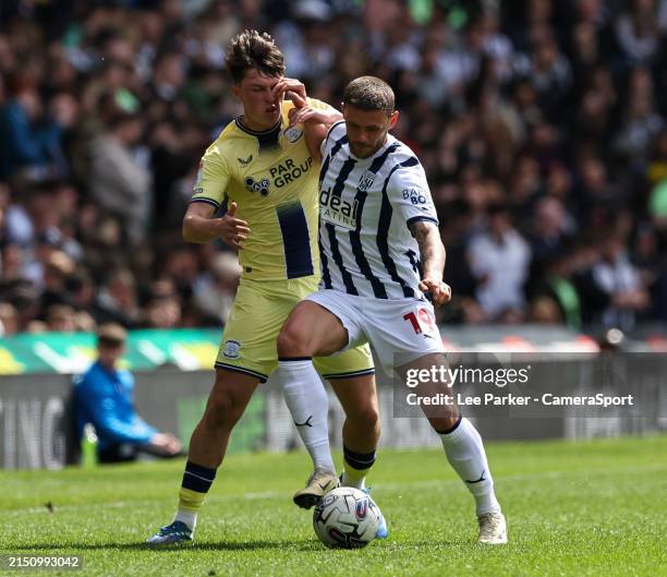 West Bromwich Albion's John Swift holds off the challenge from Preston North End's Josh Seary during the Sky Bet Championship match between West...