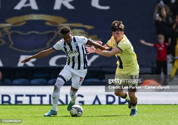 West Bromwich Albion's Grady Diangana holds off the challenge from Preston North End's Josh Seary during the Sky Bet Championship match between West...