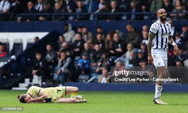 Preston North End's Will Keane holds his face after a challenge by West Bromwich Albion's Kyle Bartley during the Sky Bet Championship match between...