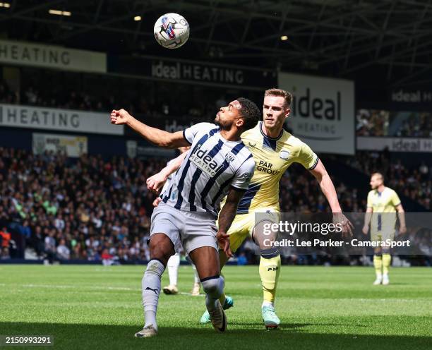 West Bromwich Albion's Darnell Furlong holds off the challenge from Preston North End's Liam Lindsay during the Sky Bet Championship match between...