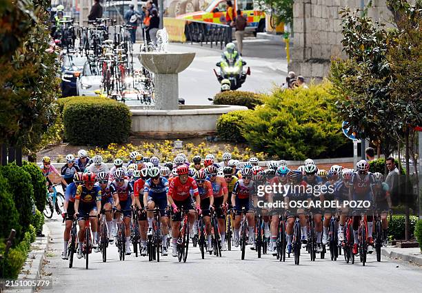 The pack of riders cycles during the 8th stage of the 2024 La Vuelta Femenina cycling tour of Spain, an 89,5 km race from Madrid to Valdesqui ski...