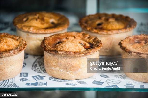 steak & ale pies on display at market - torta salgada imagens e fotografias de stock