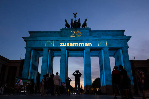 DEU: Brandenburg Gate Illuminated To Celebrate 20th Anniversary Of EU Expansion