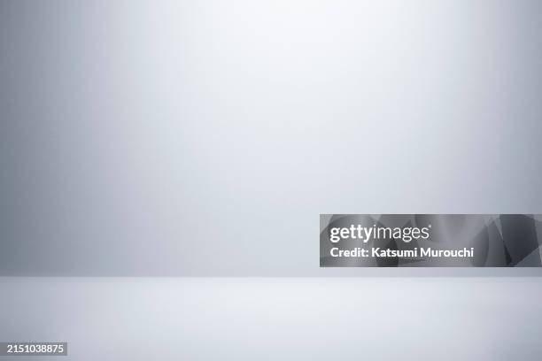 gray abstract studio wallpaper backdrop - sencillez fotografías e imágenes de stock
