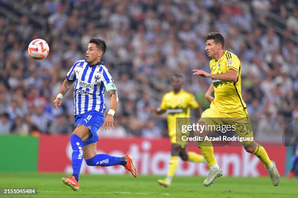 Maximiliano Meza of Monterrey chases the ball while followed by Yevhen Cheberko of Columbus Crew during the 2024 Concacaf Champions Cup semifinal...
