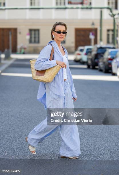 Tina Haase is seen wearing Arket blue striped button shirt and pyjama pants, Y Project white ribbed tanktop, beige Loewe Basket Bag, Celine...