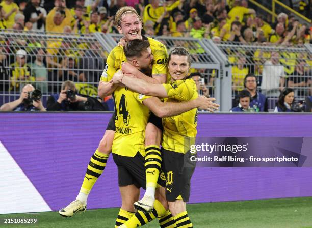 Niclas Füllkrug of Borussia Dortmund celebrates with teammates Julian Brandt und Marcel Sabitzer after scoring his teams first goal during the UEFA...