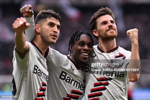 Bayer Leverkusen's Dutch defender Jeremie Frimpong , Bayer Leverkusen's German midfielder Jonas Hofmann and Bayer Leverkusen's Argentine midfielder...