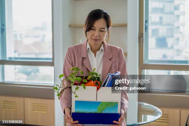 mature woman getting fired from work - midlife crisis stock pictures, royalty-free photos & images