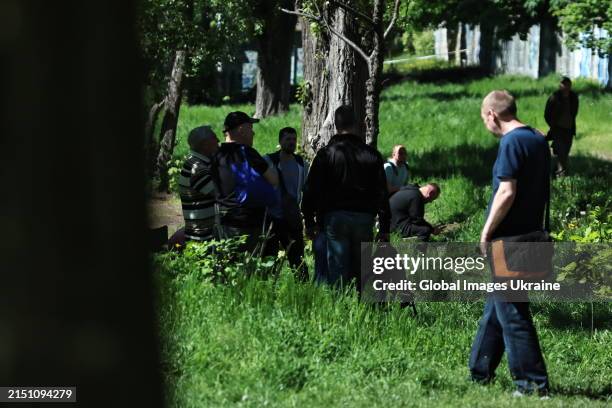 Males of conscription age wait their turn to military commissariat to update their data on May 2, 2024 in Kyiv, Ukraine. Long queues at military...