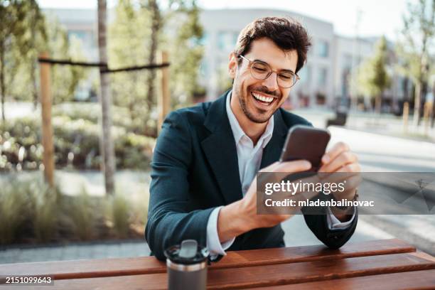 handsome businessman on a street - smart man in glasses stock pictures, royalty-free photos & images