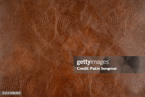 Brown color leather is made from the hides of animals texture as background. Brown color leather is made from the hides of animals texture as background.