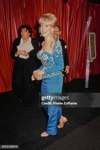 American actress Barbara Eden, wearing a blue evening gown with silver brocade, attends a Starlight Foundation charity benefit, at the 20/20 Club in...