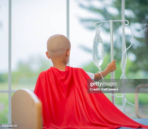 sitting through treatment bravely - super male syndrome stock pictures, royalty-free photos & images