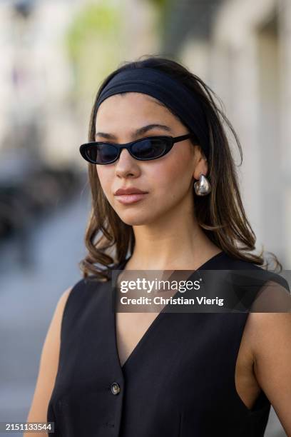 Bella Emar is seen wearing My Essential wardrobe vest, Na-kd black skirt and sunglasses, Hermes belt & bag on May 02, 2024 in Berlin, Germany.
