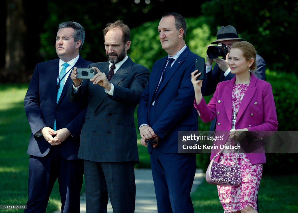 Actor Ralph Actor Ralph Fiennes joined by others watches as U.S. President Joe ...