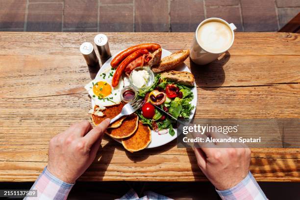 person eating breakfast at the restaurant, personal perspective view - sunny side up stock pictures, royalty-free photos & images
