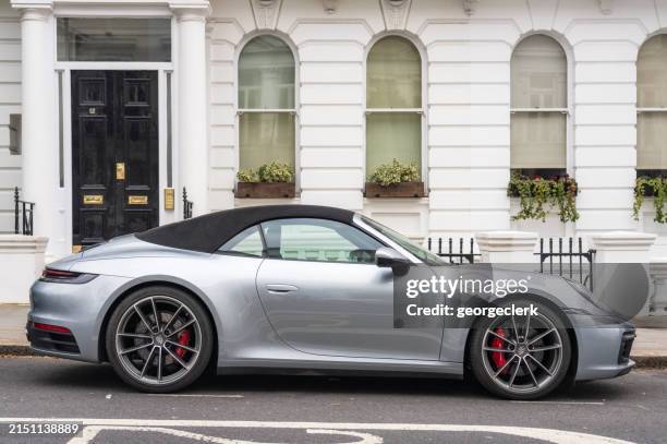 porsche 992 carrera on london street - porsche stock pictures, royalty-free photos & images