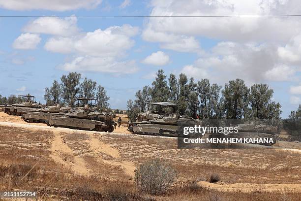 Israeli army tanks take position in southern Israel near the border with the Gaza Strip on May 6 amid the ongoing conflict between Israel and the...