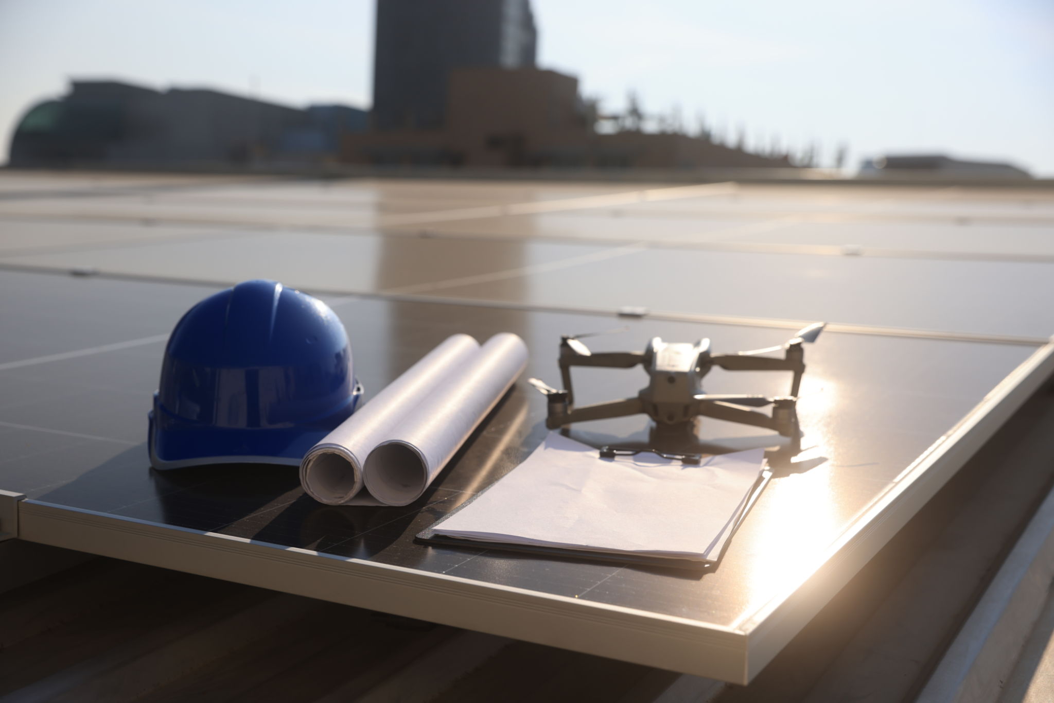 Construction and engineering tools, illustration, Drone, remote control, blueprint, and protective helmet at the construction site. I use unmanned aerial vehicles (UAV) for land and building site surveys in civil engineering projects. Construction and engineering tools, illustration, Drone, remote control, blueprint, and protective helmet at the construction site. I use unmanned aerial vehicles (UAV) for land and building site surveys in civil engineering projects.