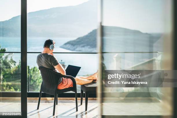 modern work and professions. a young ceo and entrepreneur working from the remote villa - överklass bildbanksfoton och bilder
