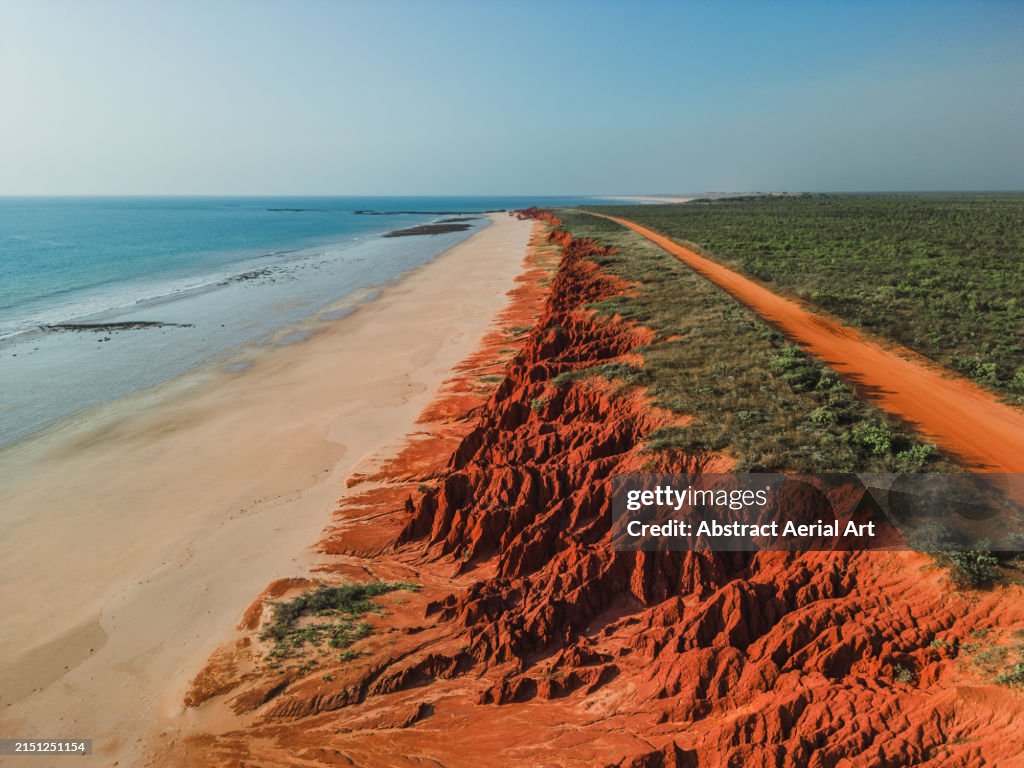 Sandstone cliffs at James Price Point shot from an aerial perspective on a sunny afternoon, Broome, The Kimberley, Western Australia, Australia