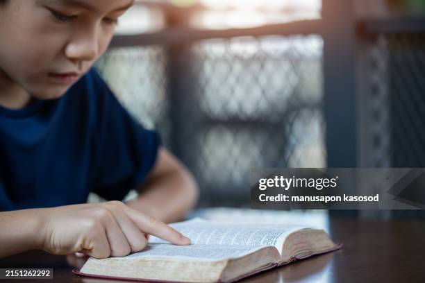 Boy Reading Scriptures 469 Boy Reading Bible Stock Photos, High-Res Pictures, and Images ...