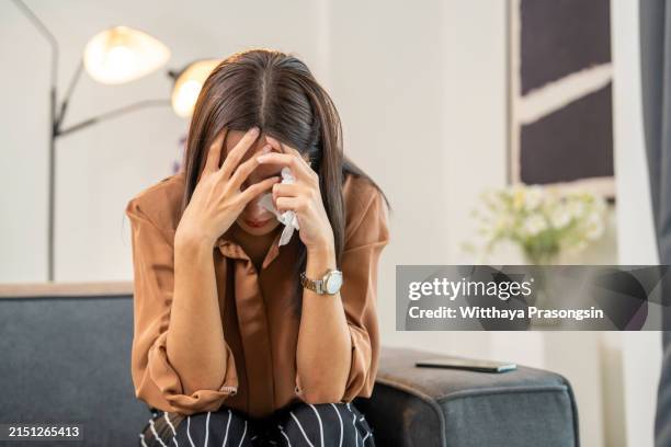 stress young woman covering her face with hands and crying. - mujeres de mediana edad fotografías e imágenes de stock