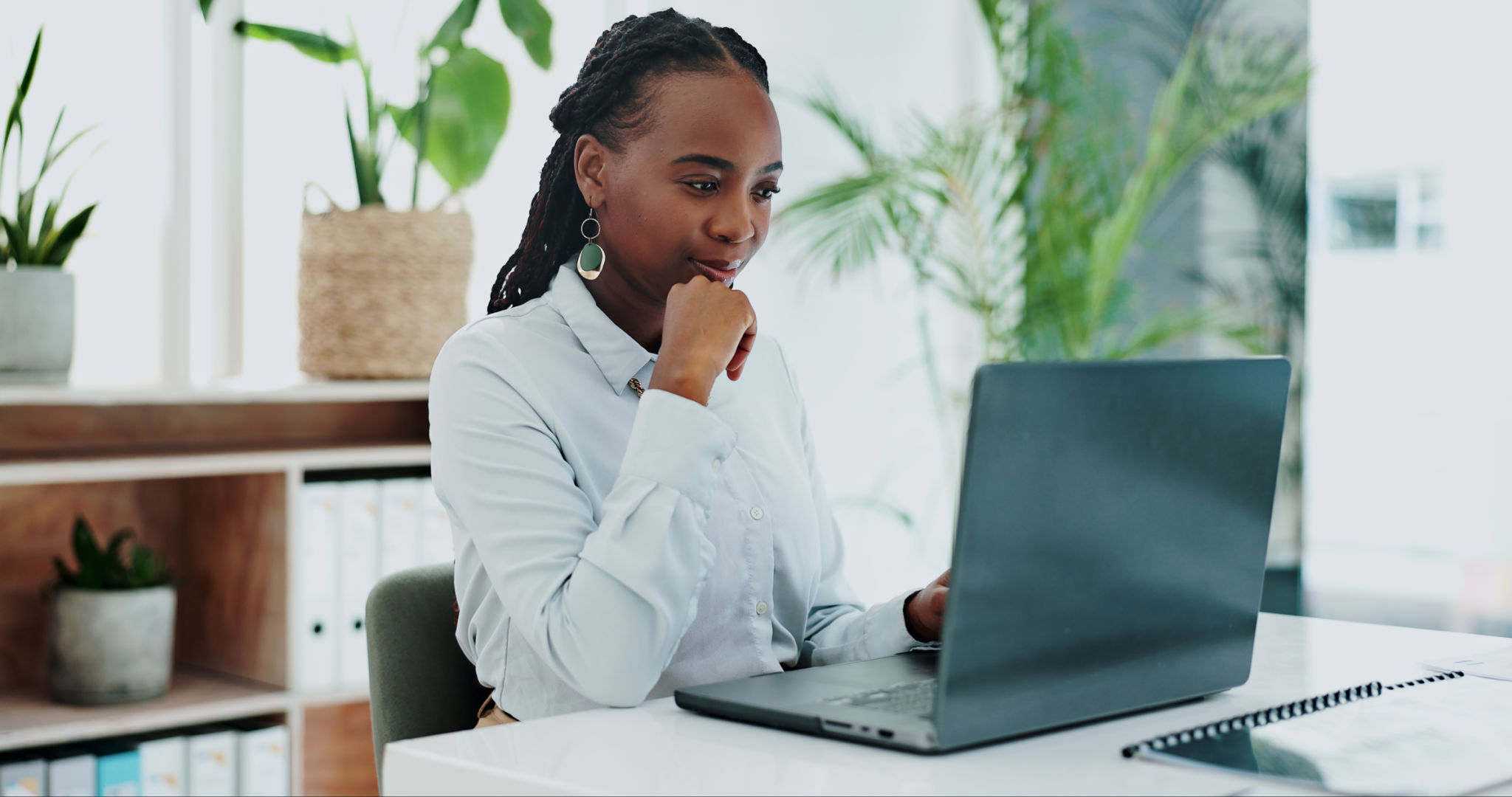 Business woman, thinking and laptop for online research in office and information on digital tech at desk. Black person, editor and inspiration on internet and creative writing on computer on blog Business woman, thinking and laptop for online research in office and information on digital tech at desk. Black person, editor and inspiration on internet and creative writing on computer on blog