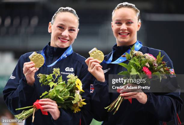 Kate Shortman and Isabelle Thorpe of Great Britain celebrate with the gold medal after their routine during the Women's Duet Technical during the...