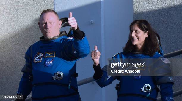 Astronauts Butch Wilmore and Suni Williams walk out of the Neil Armstrong Operations and Checkout Building at the Kennedy Space Center on May 6, 2024...