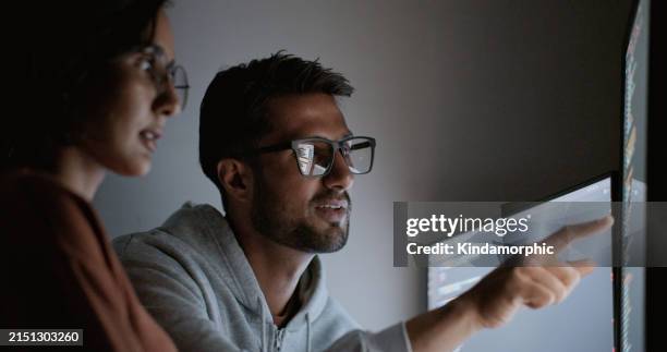hispanic latin american couple, software engineer developer use computer, work on program coding together at home office. programming language development technology, freelance job at night concept - data science stock pictures, royalty-free photos & images