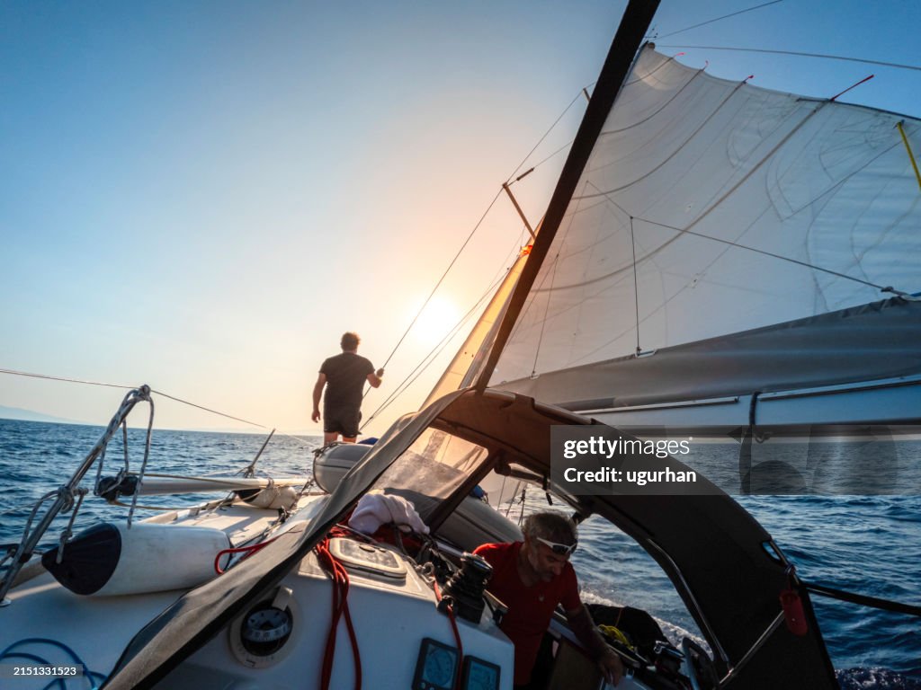 Sailor watching the environment on a sailboat.