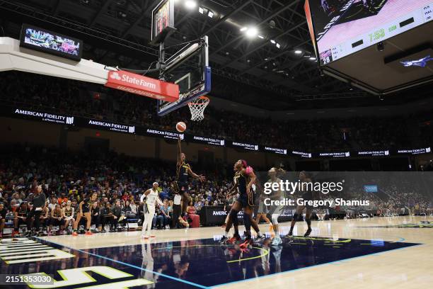 Erica Wheeler of the Indiana Fever drives to the basket against the Dallas Wings in front of a sold out College Park Center during a pre season game...