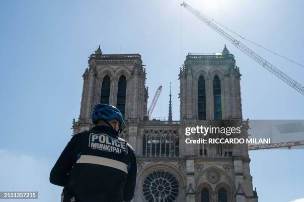 Police officers from the Municipal Police monitor the square in front of Notre-Dame de Paris, France, May 7, 2024. The municipal police present on...