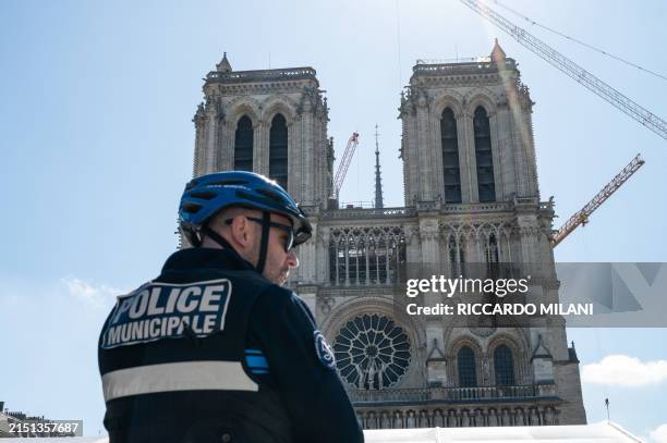 Police officers from the Municipal Police monitor the square in front of Notre-Dame de Paris, France, May 7, 2024. The municipal police present on...