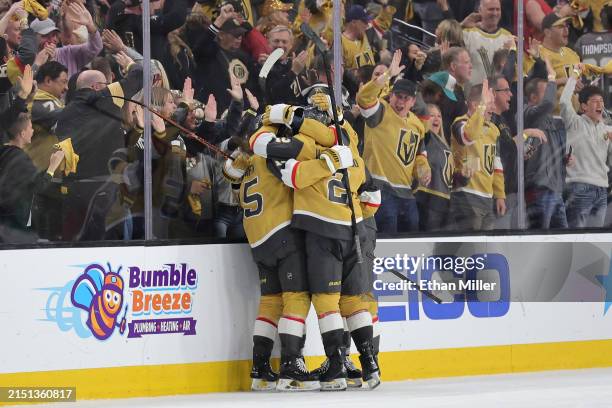 Noah Hanifin of the Vegas Golden Knights celebrates with teammates after scoring a goal against the Dallas Stars during the third period of Game Six...