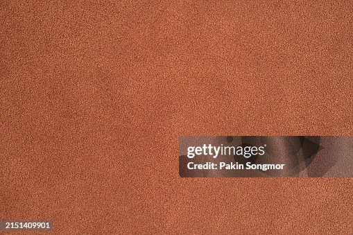 Brown color velvet texture with lighting as background. Brown color velvet texture with lighting as background.