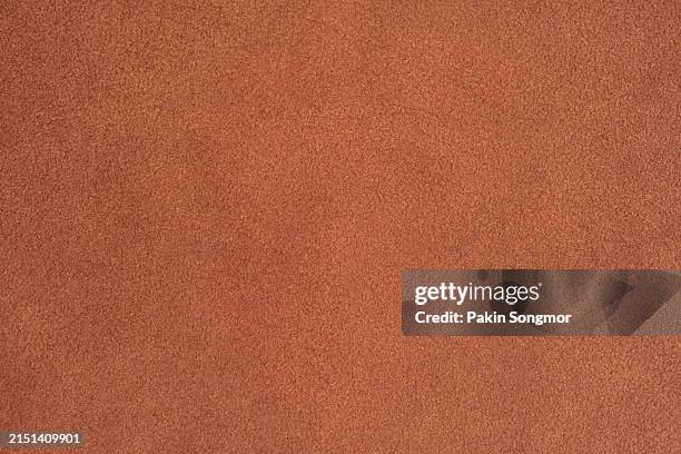 brown color velvet texture with lighting as background. - couro imagens e fotografias de stock
