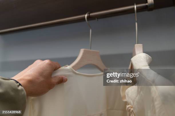 reach for the women's pajamas - rack stock pictures, royalty-free photos & images