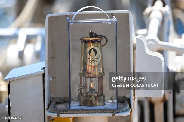 This photograph shows the Olympic flame on the French 19th-century three-masted barque Belem as the boat sails near the coast of Marseille, in the...