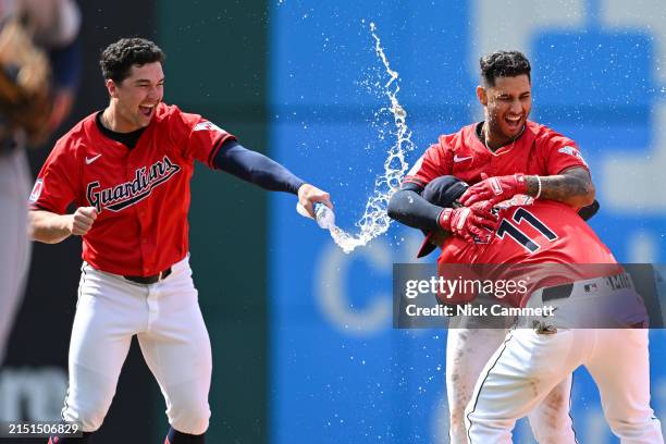 Will Brennan, Brayan Rocchio and José Ramírez of the Cleveland Guardians celebrate a walk off RBI single hit by Rocchio to defeat the Detroit Tigers...