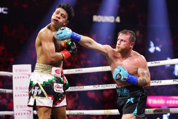 Canelo Alvarez of Mexico lands a punch on Jaime Munguia during their super middleweight title fight at T-Mobile Arena on May 04, 2024 in Las Vegas,...