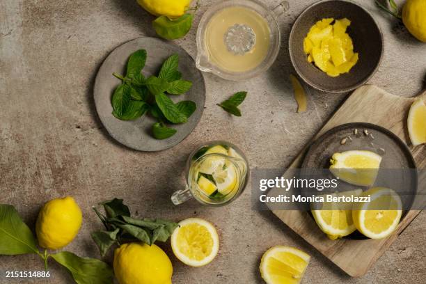 preparation of lemonade with mint leaves - lime squeeze stock pictures, royalty-free photos & images