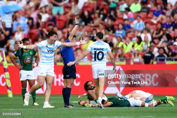 Matteo Graziano and Tobias Wade of Argentina celebrate after the men's 5th place playoff match victory over South Africa during day three of the HSBC...