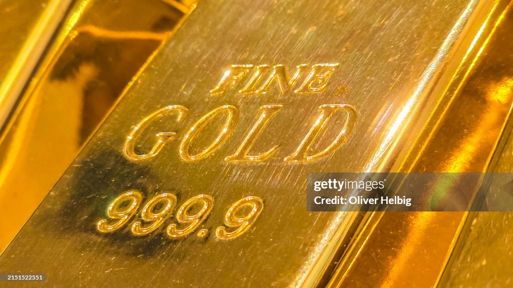 A fine gold bar with the number 999.99 on it.