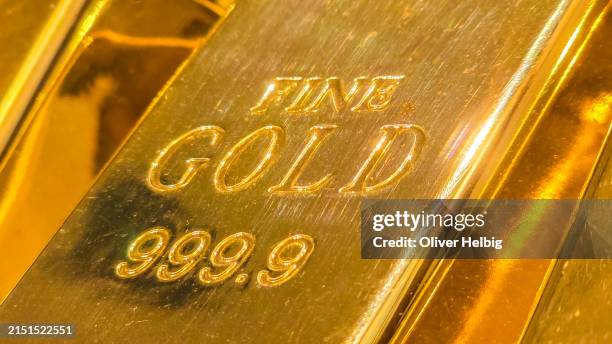 a fine gold bar with the number 999.99 on it. - guldtacka bildbanksfoton och bilder